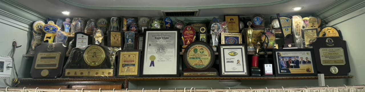 Dr. V.K. Pankajakshan receiving a prestigious award for homoeopathic service